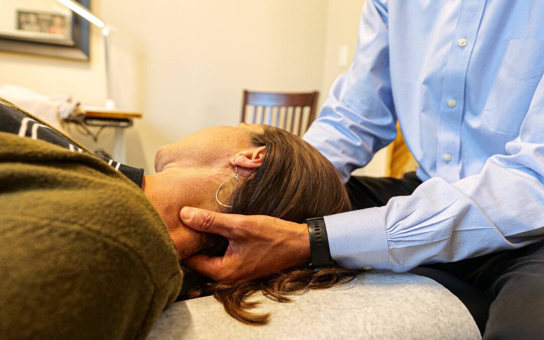 Chiropractor delivers soft tissue treatment to neck for pain relief